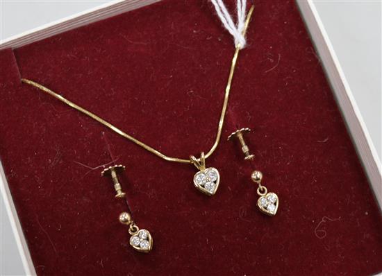 A pair of diamond and 9ct gold heart-shaped earrings and a similar pendant on 18ct gold chain.